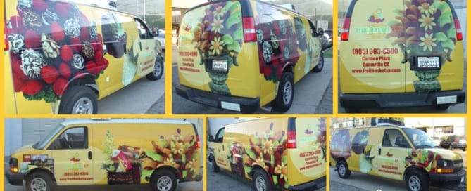 a yellow van with a bunch of flowers painted on it.